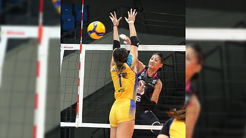 DINDIN Santiago-Manabat of Akari tests the defense of Janine Navarro of Capital1 during the PVL All-Filipino Conference game yesterday. The Power Chargers prevailed, 25-17, 25-14, 25-20.