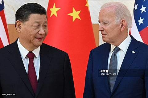 Presidents Joe Biden and Xi Jinping clashed in a telephone call Tuesday about US trade restrictions on technology and on Taiwan, but they looked to manage their tensions, with two top US officials heading shortly to Beijing.