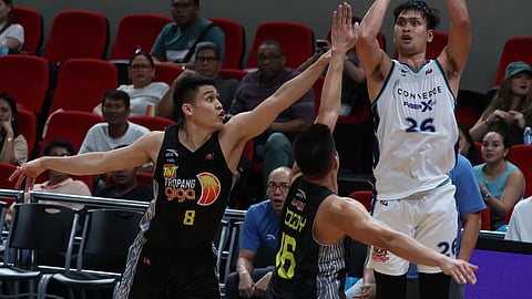Bryan Santos gets plenty of help from the bench as Converge denies TNT a formal entry into the playoffs of the PBA Philippine Cup on Wednesday at the Philsports Arena in Pasig City.