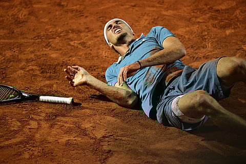 ALEXANDER Zverev grimaces in pain after suffering a bad fall during his quarterfinal clash with Taylor Fritz in the men’s singles event of the Rome Open.