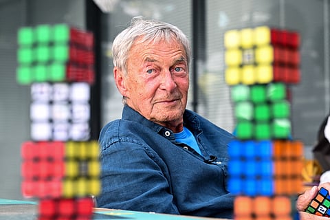 Hungarian inventor Erno Rubik sits next to several Rubik’s Cubes in Budapest. It was a spring day in 1974 when Hungarian architecture professor Erno Rubik created the first prototype of a movable cube made out of small wooden blocks and held together by a unique mechanism.
