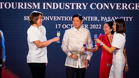 (FILES) PRESIDENT Ferdinand Romualdez Marcos Jr. leads a ‘unity toast’ for the country’s tourism industry during the Philippine Tourism Industry Convergence Reception by the Department of Tourism at the SMX Convention Center in Pasay City on Monday. Giving BBM a toast are Vice President Sara Duterte (left), First Lady Liza Marcos (third from left), and Tourism Secretary Christina Garcia-Frasco (right). 

