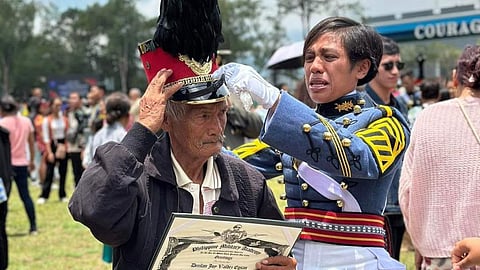 Clan honor Cadet 1st Class Decilan Joy Valdez Egsan ‘crowns’ her lolo with her parade hat as appreciation for the support her family in graduating from the Philippine Military Academy class of 2024. 