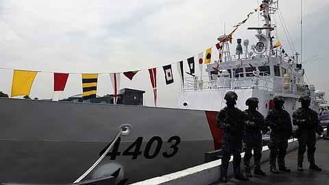 (FILES) Members of the Philippine Coast Guard anti-terrorism unit stand next to the newly commissioned Coast Guard's Multi-Role Response Vessel (MRRV) BRP Malapascua during a ceremony at the Coast Guard headquarters in Manila on 7 March 2017. 
