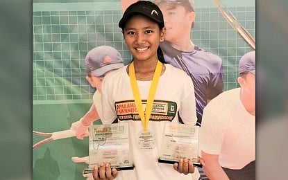 TOP JUNIOR NETTER. Olongapo City's Jan Cadee Dagoon holds the girls' 14-under (champion) and 16-under (runner-up) trophies during the awarding ceremony of the Dr. Pablo Olivarez Sr. National Junior Tennis Championships in Parañaque on May 13, 2024. She is among the title contenders at the Calderon Cup scheduled in Roxas, Isabela from May 24 to 27, 2024