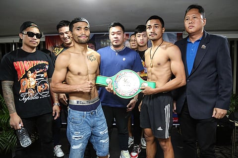 Marlon Tapales (left) and Thai rival Nattapong Jankaew display their readiness for their 12-round bout while promoter JC Mananquil (middle) strikes a pose during Thursday’s weighin at the Midas Hotel and Casino. Tapales and Jankaew square off Friday night.