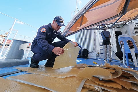 A Philippine Coast Guard personnel inspects the damage inflicted on BRP Bagacay after being besieged by China Coast Guard water cannons during a maritime patrol on 30 April. The bombardment cost the government up to P3 million for repairs.