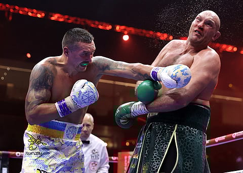Oleksandr Usyk of Ukraine scores against Tyson Fury of Great Britain in their undisputed world heavyweight title fight Sunday in Saudi Arabia. Usyk won by split decision.