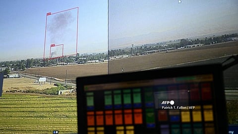 (FILES) Red boxes indicate potential fire starts on a screen of cameras with artificial intelligence (AI) technology powering the ALERTCalifornia wildfire camera network to help firefighters detect new fire starts from Cal Fire's San Diego County headquarters in El Cajon, California on 6 September 2023. 