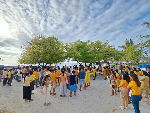 faithful gathering by the seashore.