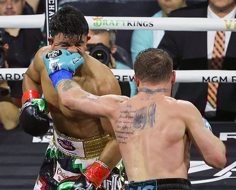 Canelo Alvarez land a solid hit on Jaime Munguia in their all-Mexican undisputed world super-middleweight title fight Saturday (Sunday in Manila) in Las Vegas. Alvarez won by unanimous decision.