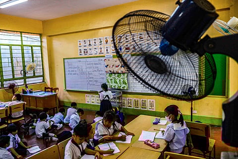Bummer summerTykes in a school get a slight relief from the heat with the strategically placed fans. The school calendar has returned to the old schedule starting this year.