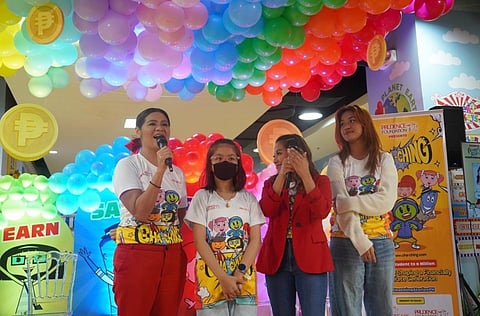 Raine Nakpil (right) with TV personality Candy Pangilinan (left) and other Cha-Ching alumni during the one million launch.
