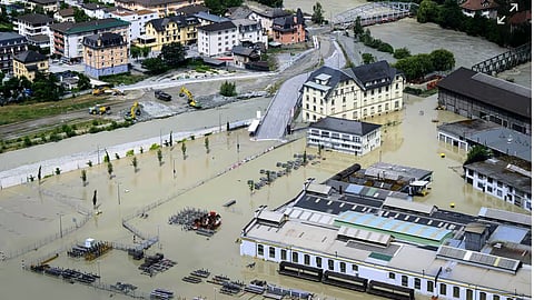The Rhone in Chippis, Switzerland, overflowed due to ferocious storms and torrential rains, leading to flooding of a highway and a railway line close by.