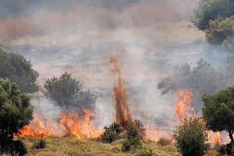 Fires burn the vegetation after rockets launched from southern Lebanon landed on the outskirts of Safed, in Israel's upper Galilee, on June 12, 2024. Lebanon's Hezbollah, a Hamas ally, and Israel have been trading near-daily fire since the Gaza war was trigged by the Palestinian militant group's October 7 attack on southern Israel.
