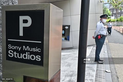 A security guard stand outside the entrance to the Sony Music Studios.