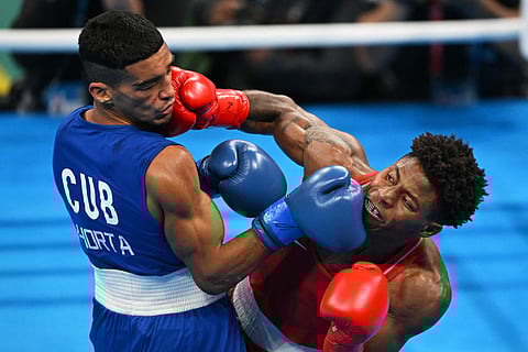 Jahmal Harvey of the United States (right) is one of the top guns in the featherweight division of the Paris Olympics.
