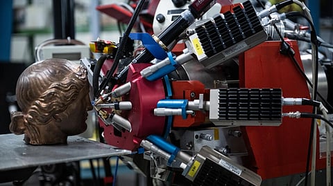 A bronze statue is tested with the center's particle accelerator © 