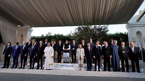 (First row Left side) Argentine's President Javier Milei, Kenya's President William Ruto, US President Joe Biden, Mauritania's President Mohamed Ould Ghazouani, Turkish President Recep Tayyip Erdogan and Pope Francis (6th-L) and (First row Right side - From L) Italy's Prime Minister Giorgia Meloni, Jordan's King Abdullah, France's President Emmanuel Macron, Algeria's President Abdelmadjid Tebboune, United Arab Emirates’ President Sheikh Mohamed bin Zayed Al Nahyan, Brazilian President Luiz Inacio Lula da Silva, UN Secretary-General Antonio Guterr (Second row), President of the European Council Charles Michel (3rd-L), British Prime Minister Rishi Sunak (4th-L), Japanese Prime Minister Fumio Kishida (5th-L), India's Prime Minister Narendra Modi (6th-L), German Chancellor Olaf Scholz (7th-L) and Canada's Prime Minister Justin Trudeau (8th-L) pose for a family photo with G7 heads of States and heads of delegation of Outreach countries at Borgo Egnazia resort during the G7 Summit hosted by Italy, in Savelletri, on June 14, 2024. 