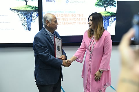 Rina Neoh, secretary general of ESG Association of Malaysia, keynote speaker in the seminar on Transforming the Philippines From Its Plastic Legacy through EPR jointly organized by the Rotary Club of Makati and P&A Grant Thornton, is congratulated and given a plaque of appreciation by RC Makati president Bing Matoto. The seminar was held last 20 June 2024 at  the P&A Office, Tower 1, The Enterprise Center in Makati.