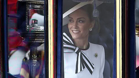 Britain's Catherine, Princess of Wales, smiles inside the Glass State Coach on her way to Horse Guards Parade for the King's Birthday Parade "Trooping the Colour" in London on 15 June 2024. 