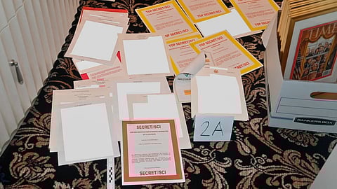 This image contained in a court filing by the Department of Justice on Aug. 30, 2022, and partially redacted by the source, shows a photo of documents seized during the Aug. 8 FBI search of former President Donald Trump's Mar-a-Lago estate.