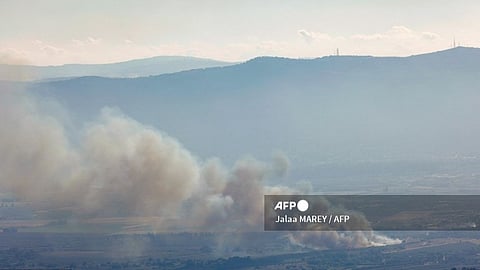 Smoke billows after a hit from a rocket fired from southern Lebanon over the Upper Galilee region in northern Israel on July 30, 2024, amid ongoing cross-border clashes between Israeli troops and Hezbollah fighters. Israeli medics on July 30 said one civilian, a 30-year-old man, was killed following a rocket attack on the northern kibbutz of HaGoshrim. The Israeli army meanwhile reported its forces were "striking the sources of fire" after the projectiles were fired from Lebanon.