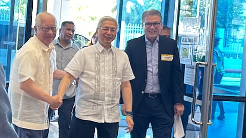 Trade and Industry Secretary Alfredo Pascual (center) receives warm greetings from Batangas Governor Hermilando Mandanas (left) and First Philippine Industrial Park president Francis Giles Puno (right) during a round table discussion yesterday. During the forum, Pascual thanked foreign investors for their continuing confidence in the Philippines and vowed to continue supporting efforts by the private sector to attract more investments. 
