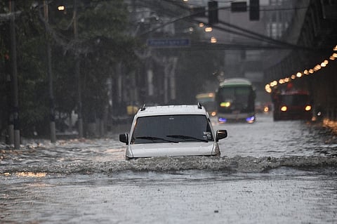 (FILE PHOTO) A COMMON sight in Metro Manila’s streets these rainy days.