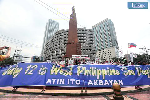 (FILES) On Friday July 12, 2024, activists and progressive groups led by the Atin Ito WPS Coalition and Akbayan Youth held protest at the Boy Scout Circle in Quezon City to commemorate the Philippines' 8th anniversary of victory over China at the Permanent Court of Arbitration in Hague.  Calling for the annual declaration of July 12 as West Philippine Sea Day, while condemning the ongoing harassment of Philippine resupply vessels in its exclusive economic zone.