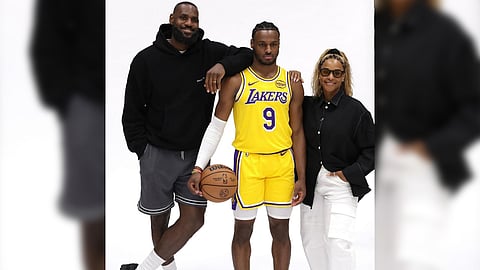 BRONNY James is flocked by his father and Los Angeles teammate LeBron and mom Savannah during his formal introduction as a member of the Lakers.
