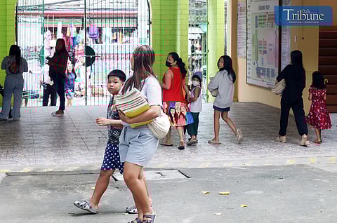 LOOK: A day before the start of the new school year at Bagong Silangan Elementary School in Quezon City, teachers and parents are seen making last-minute preparations inside the classrooms on Sunday, 28 July 2024.  