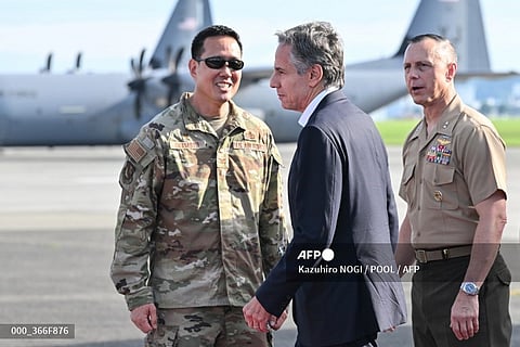 US Secretary of State Antony Blinken (C) is welcomed upon arrival for the start of his two-day visit, at Yokota Air Base in Fussa, western Tokyo, on July 28, 2024.
