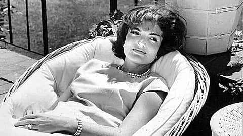 FILE--This is a 1961 file handout photo from the John F. Kennedy Library & Museum showing former First Lady Jacqueline Kennedy Onassis relaxing in a patio chair at the Kennedy family home at Hyannisport, Mass., on Cape Cod in 1961.