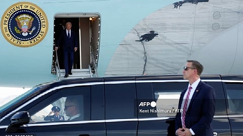 A Secret Service agent stands by as US President Joe Biden steps off Air Force One upon arrival at Harry Reid International Airport in Las Vegas, Nevada, on July 15, 2024. After cutting his vacation short and postponing a trip following the assassination attempt on former US President Donald Trump, President Biden is returning to semi-normal travel.