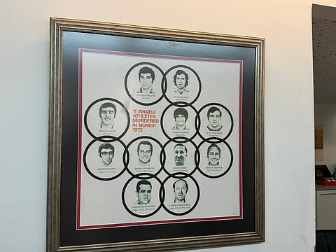A framed photo of the 11 Israeli athletes who were murdered by Palestinian terrorists in the Munich Olympics in 1972 hangs on the wall of the Israeli Olympic Committee headquarters in Tel Aviv.    