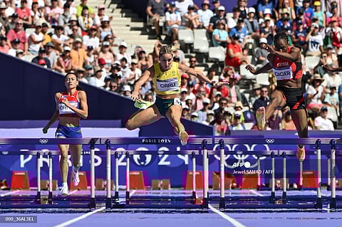 LAUREN Hoffman of the Philippines (left) gets dominated by Sarah Carli of Australia and Yasmin Giger of Switzerland in the repechage of the women’s 400-meter hurdles of the Paris Olympics at Stade de France. 