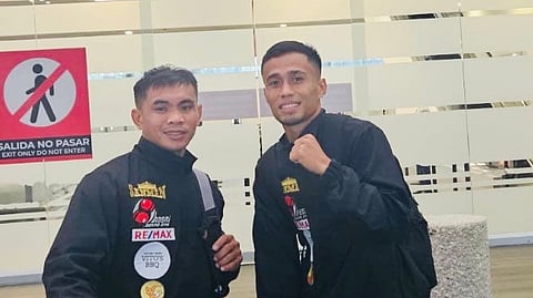 Dave ‘Doberman’ Apolinario (right) and lead trainer Ronerex Dalut touch down in Mexico City five days before the Filipino flyweight’s crack at the vacant IBF throne. 