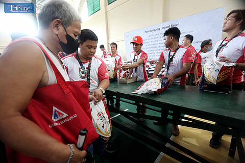 LOOK: Long lines formed as people rush to purchase P29 per kilo rice at the launch of the "Murang Bigas sa NIA at P29" program at the NIA headquarters in Quezon City on 8 August 2024. This project supports President Ferdinand Marcos Jr.'s goal of ensuring food security and boosting the country's economy. 