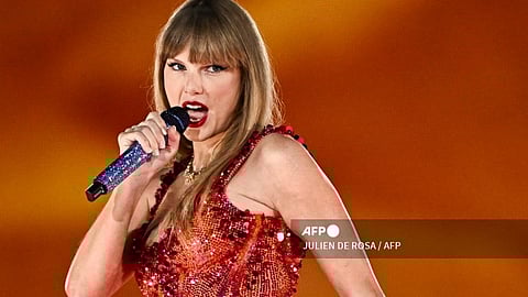 (FILES) US singer Taylor Swift performs on stage at the Paris La Defense Arena as part of her The Eras Tour, in Nanterre, north-western France, on May 9, 2024. Three shows in Vienna by the American mega-star have been cancelled after Austria arrested a man in connection with an Islamist attack plot, the organisers said on August 8, 2024.