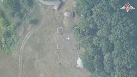 An aerial view shows smoke rising above the ground, reportedly from a Russian strike on a Ukrainian tank in the Kursk region near the border with Ukraine. 