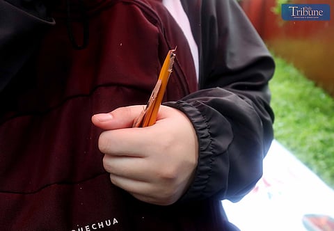(August 10 2024)……….A UPCAT taker breaks her pencil after taking the exam at Palma Hall in University of the Philippines, Quezon City on Saturday August 10 2024. She said she had to break the pen after the exam because her grandmother superstitiously told her to.…….Photo/Analy Labor
