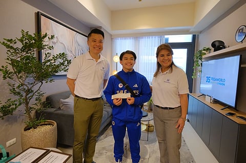 Two-time Olympic gold medalist Carlos Yulo has received a P3-million cash bonus from property giant Megaworld. This bonus is part of the company's total P35-million reward for Yulo's outstanding performance at the 2024 Paris Olympic Games. On Wednesday, Yulo officially accepted a fully furnished three-bedroom condo unit at McKinley Hill in Taguig City. The handover was conducted by Kevin L. Tan, president and CEO of Alliance Global Group, Inc. (AGI), the parent company of Megaworld, and Lourdes T. Gutierrez-Alfonso, president of Megaworld Corporation.