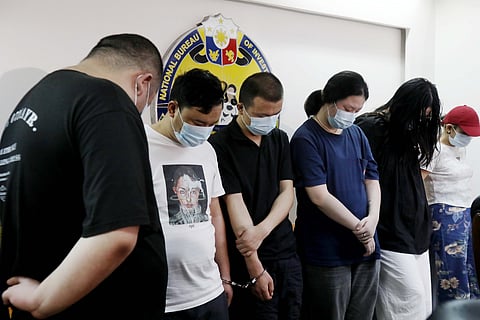 Six Chinese nationals are presented by the National Bureau of Investigation following their arrest for allegedly being involved in scams and other illegal activities on Friday.