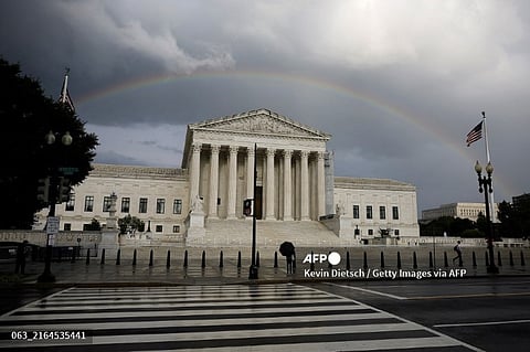 LOOK: WASHINGTON, DC - JULY 30: A rainbow and passing storm clouds are seen over the U.S. Supreme Court on July 30, 2024 in Washington, DC. President Biden is calling for Supreme Court reforms including term limits for the Justices, a binding code of ethics for the court and is calling on lawmakers to pass legislation limiting presidential immunity. | 📸 Kevin Dietsch/Getty Images/AFP Kevin Dietsch / GETTY IMAGES NORTH AMERICA / Getty Images via AFP
