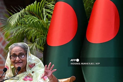 LOOK: (FILES) Bangladesh's Prime Minister Sheikh Hasina gestures while speaking to the media, a day after she won the 12th parliamentary elections, in Dhaka on January 8, 2024. Thousands of Bangladeshi protesters stormed the palace of Prime Minister Sheikh Hasina in Dhaka on August 5, with a source telling AFP she had fled mass demonstrations demanding she quit.| Photo courtesy of INDRANIL MUKHERJEE / AF 