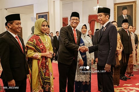 LOOK: Indonesia’s newly appointed Minister of Law and Human Rights Supratman Andi Agtas (C) shakes hands with President Joko Widodo (R) during their swearing-in ceremony at the Presidential Palace in Jakarta on 19 August 2024.|📷 Yasuyoshi CHIBA / AFP