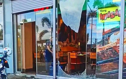 A broken glass wall at a restaurant in Catarman, Northern Samar after a magnitude 5.7 earthquake hit the province on Monday (Aug. 19, 2024). There was no major damage as a result of the temblor, according to the Provincial Disaster Risk Reduction and Management Office. 