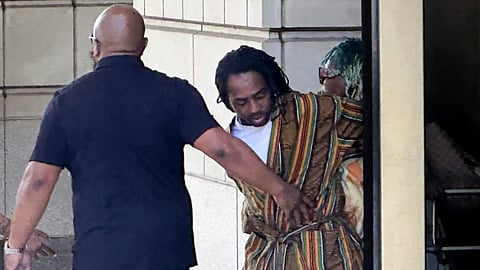District of Columbia Councilman Trayon White, Sr., center, walks out of the federal courthouse after his initial appearance, Monday, 19 Aug. 2024 in Washington. White was arrested on a federal bribery charge by the FBI on Sunday.