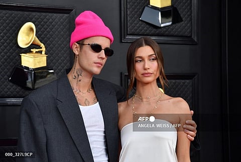 (FILES) Canadian singer-songwriter Justin Bieber (L) and US model Hailey Bieber arrive for the 64th Annual Grammy Awards at the MGM Grand Garden Arena in Las Vegas on 3 April 2022.